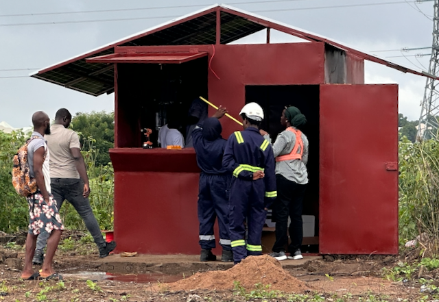 Solar panels, inverter and battery system being installed at the Gui Community Energy Project site.